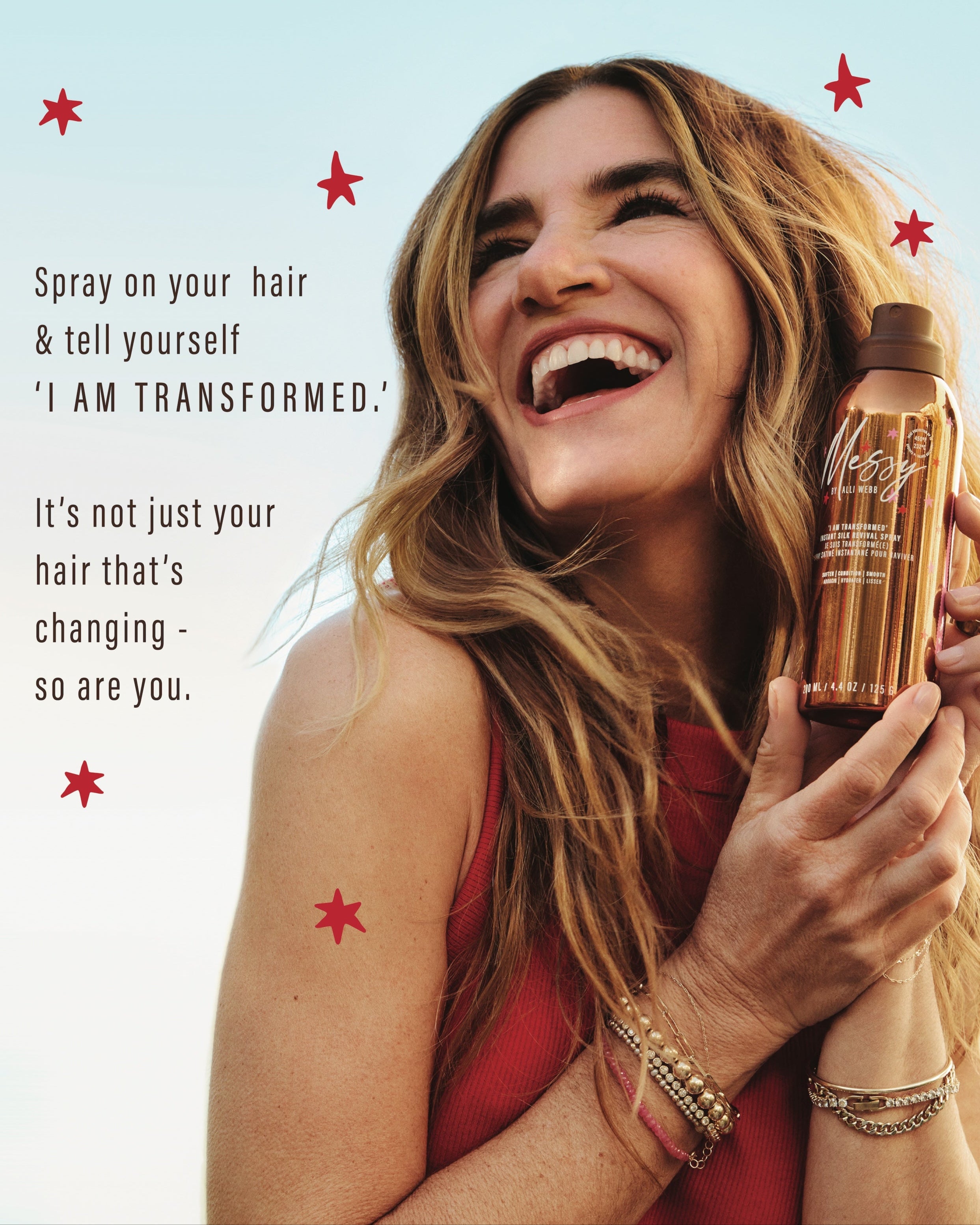 Laughing Alli Webb with tousled waves holds Instant Silk Revival Spray beside the mantra 'I AM TRANSFORMED — it's not just your hair that's changing, so are you.'